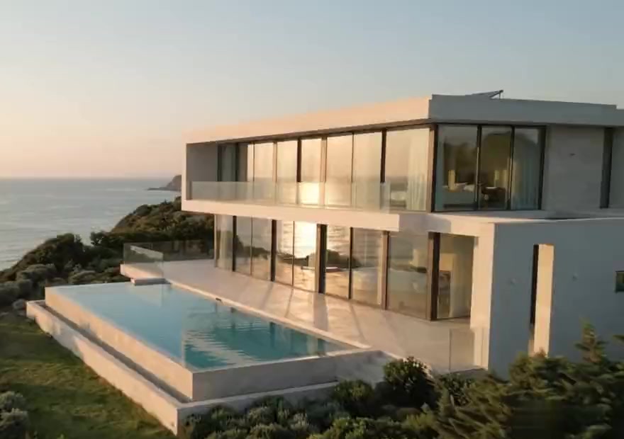 The upper floor principal suite with its glass balcony